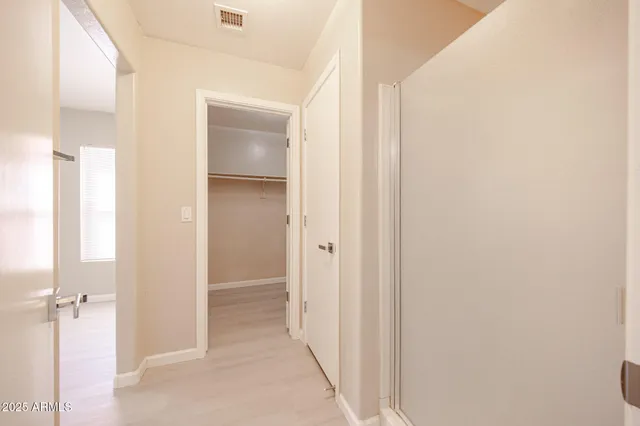 a view of a bathroom from a hallway