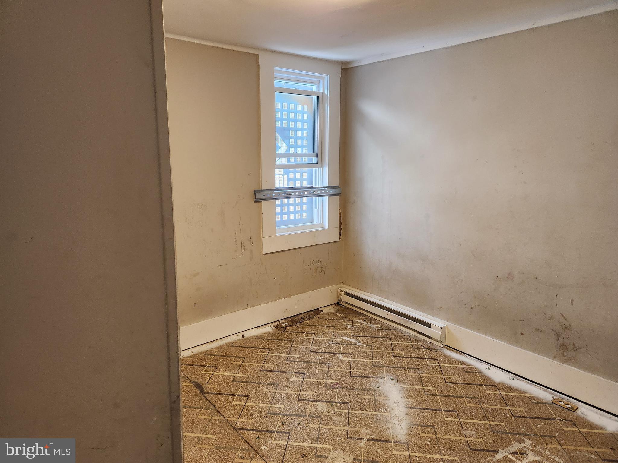 113 Eastern Boulevard Essex, MD 21221 - Photo 14 of 19 a view of empty room with windows