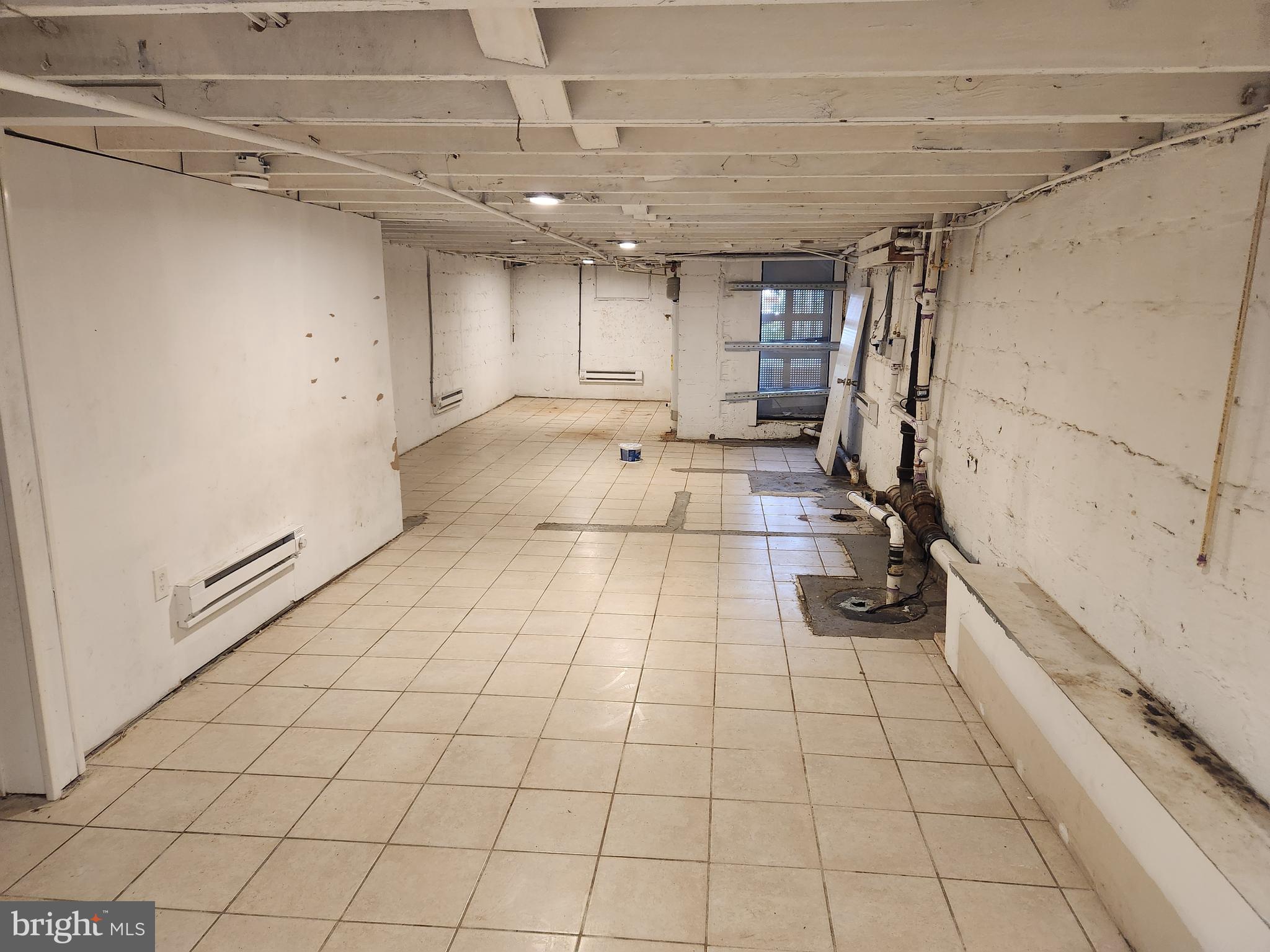 113 Eastern Boulevard Essex, MD 21221 - Photo 9 of 19 a room with gym equipment and a shower