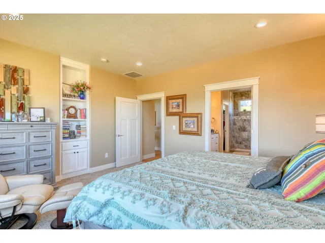 a bedroom with a bed and a cabinets