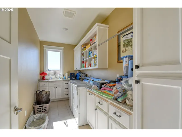 a kitchen with a cabinets and window