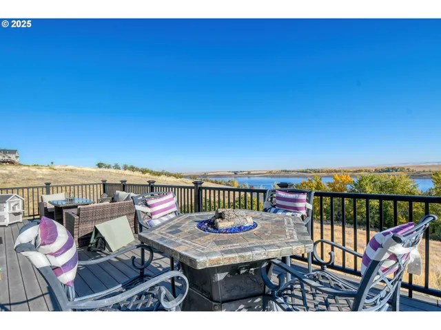 a view of a balcony with furniture