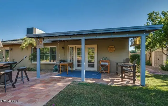 a house view with a sitting space and garden space