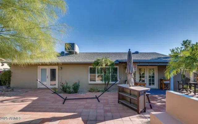 a view of a house with patio outdoor seating