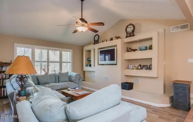 a living room with furniture and a window