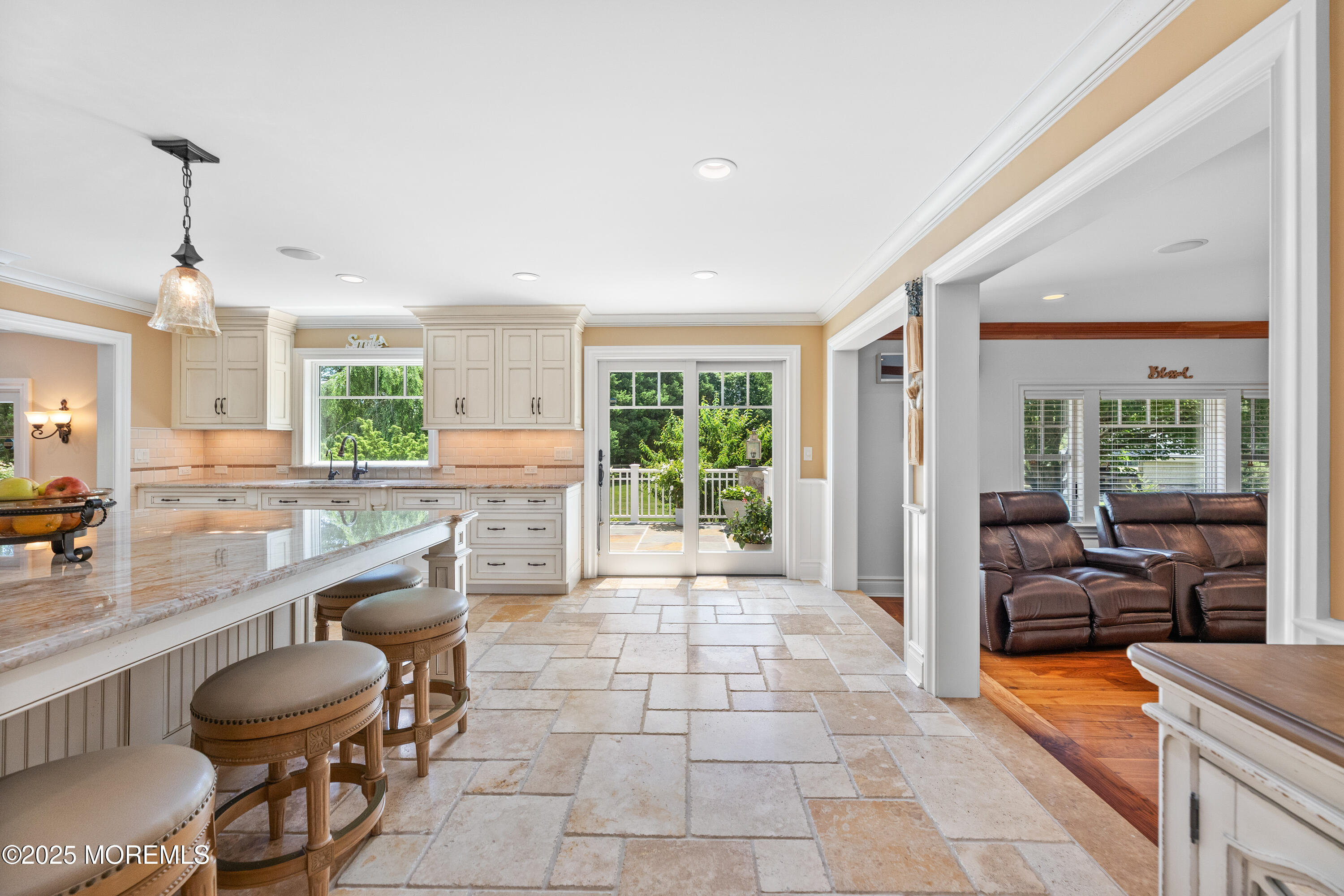 13 Indian Path Millstone Township, NJ 08535 - Photo 20 of 67 a large living room with stainless steel appliances granite countertop a couch a table and chairs in it