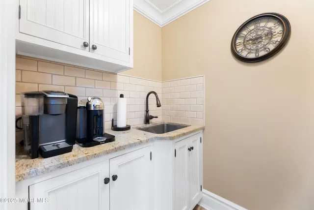 a spacious bedroom with a bed and a couch