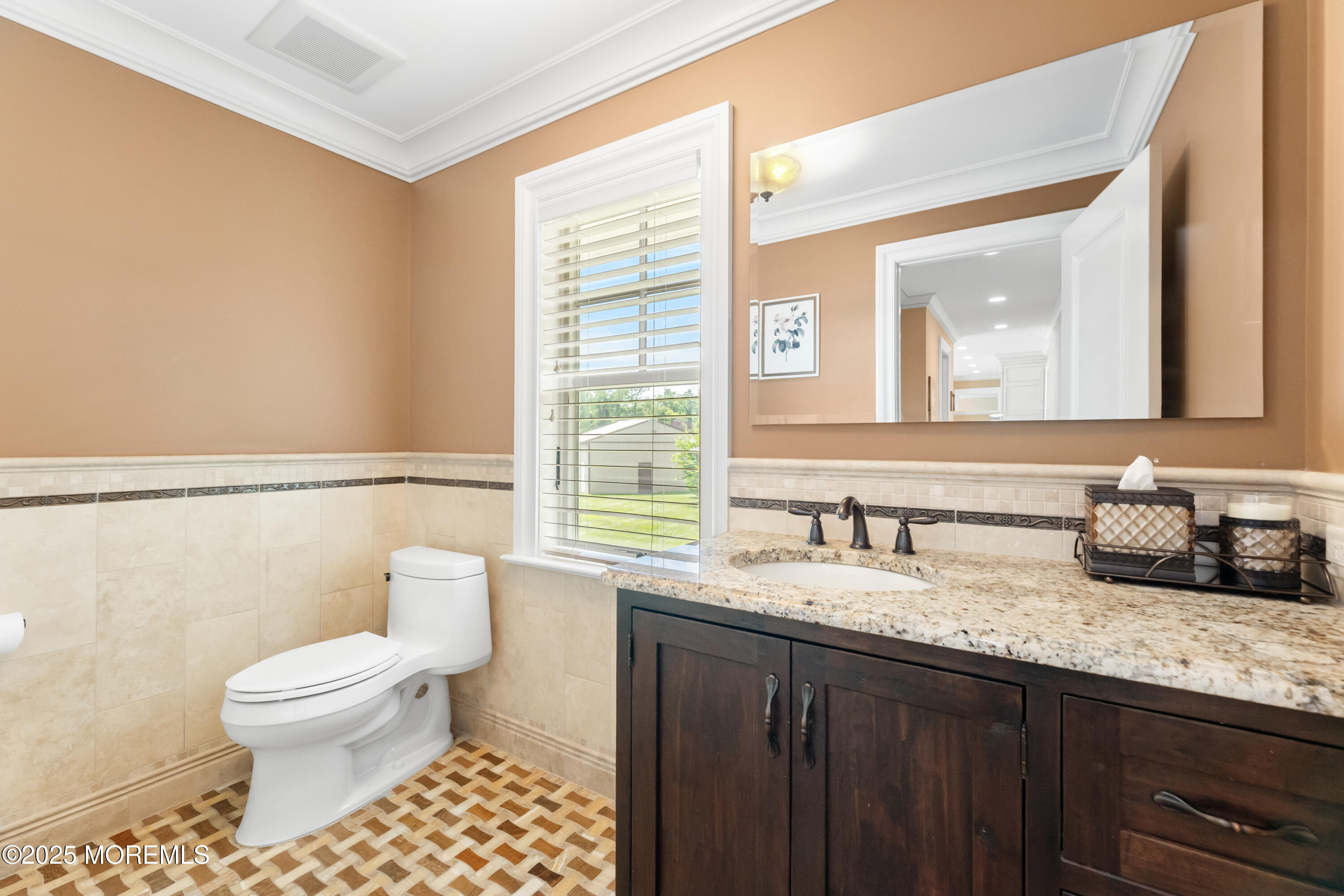 13 Indian Path Millstone Township, NJ 08535 - Photo 26 of 67 a bathroom with a granite countertop sink a toilet and a mirror