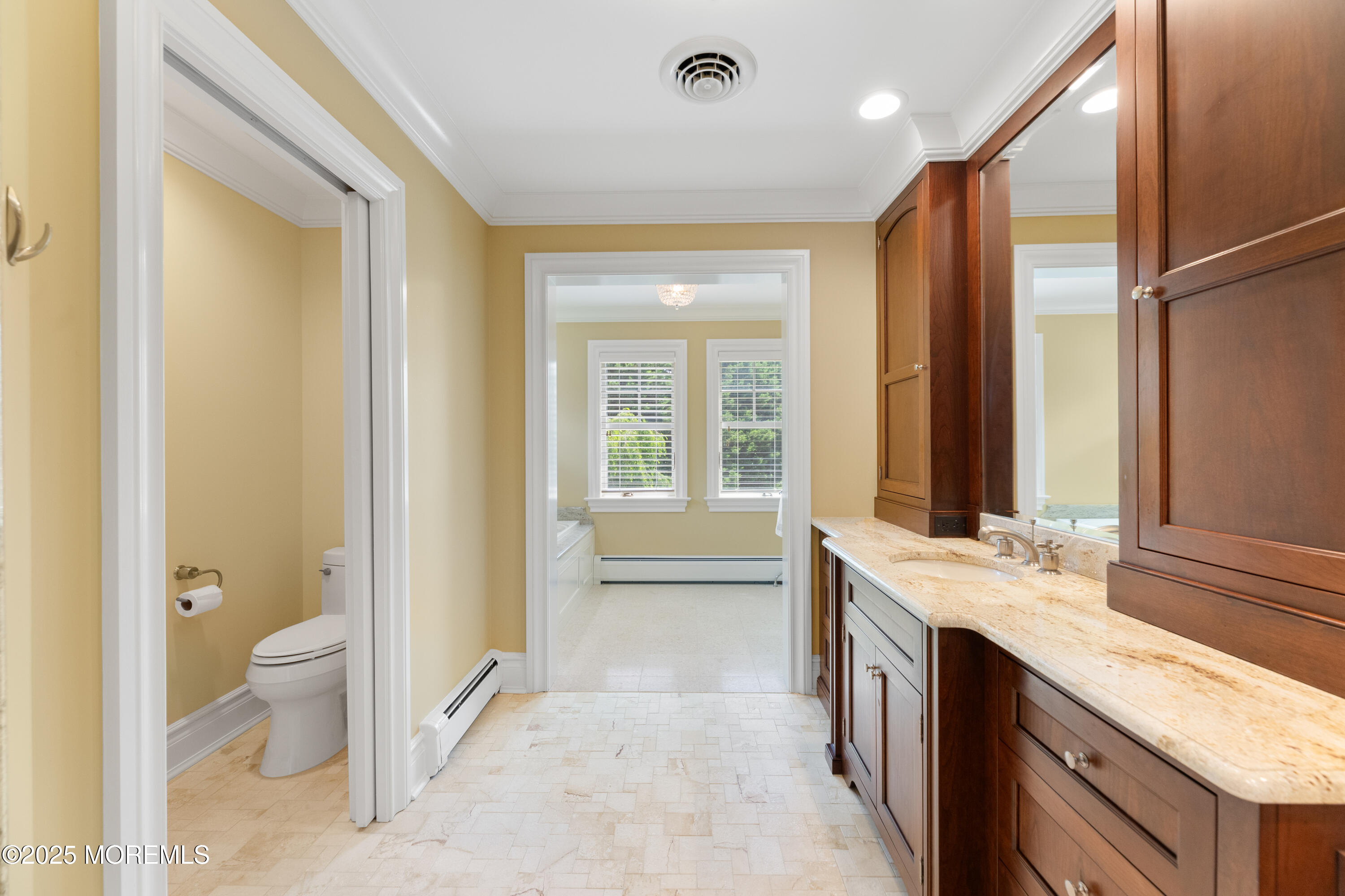 13 Indian Path Millstone Township, NJ 08535 - Photo 34 of 67 a spacious bathroom with a granite countertop sink a toilet and a large mirror