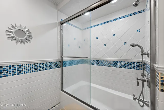 a large kitchen with a large counter top stainless steel appliances and cabinets