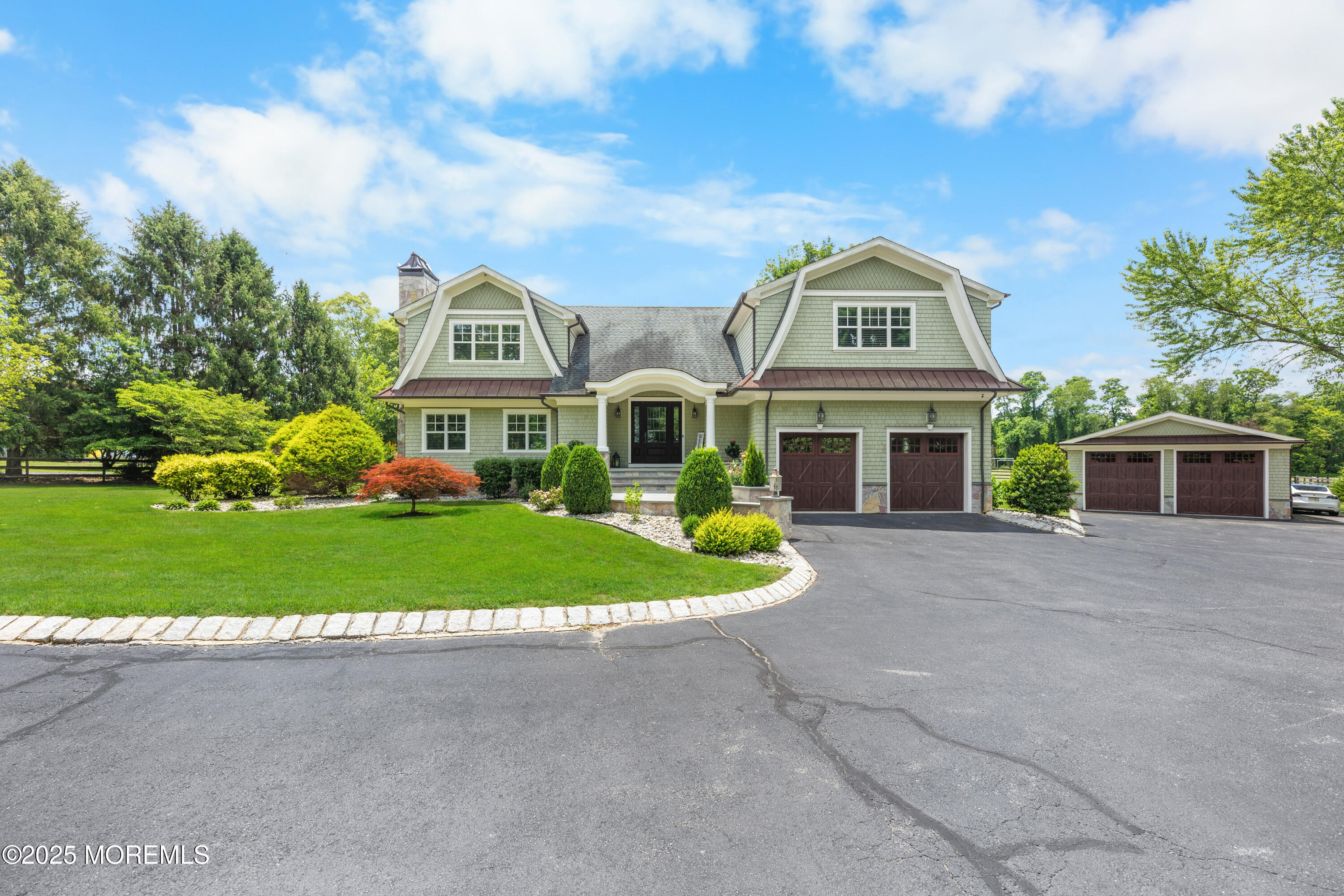 13 Indian Path Millstone Township, NJ 08535 - Photo 4 of 67 a front view of a house with a garden and plants