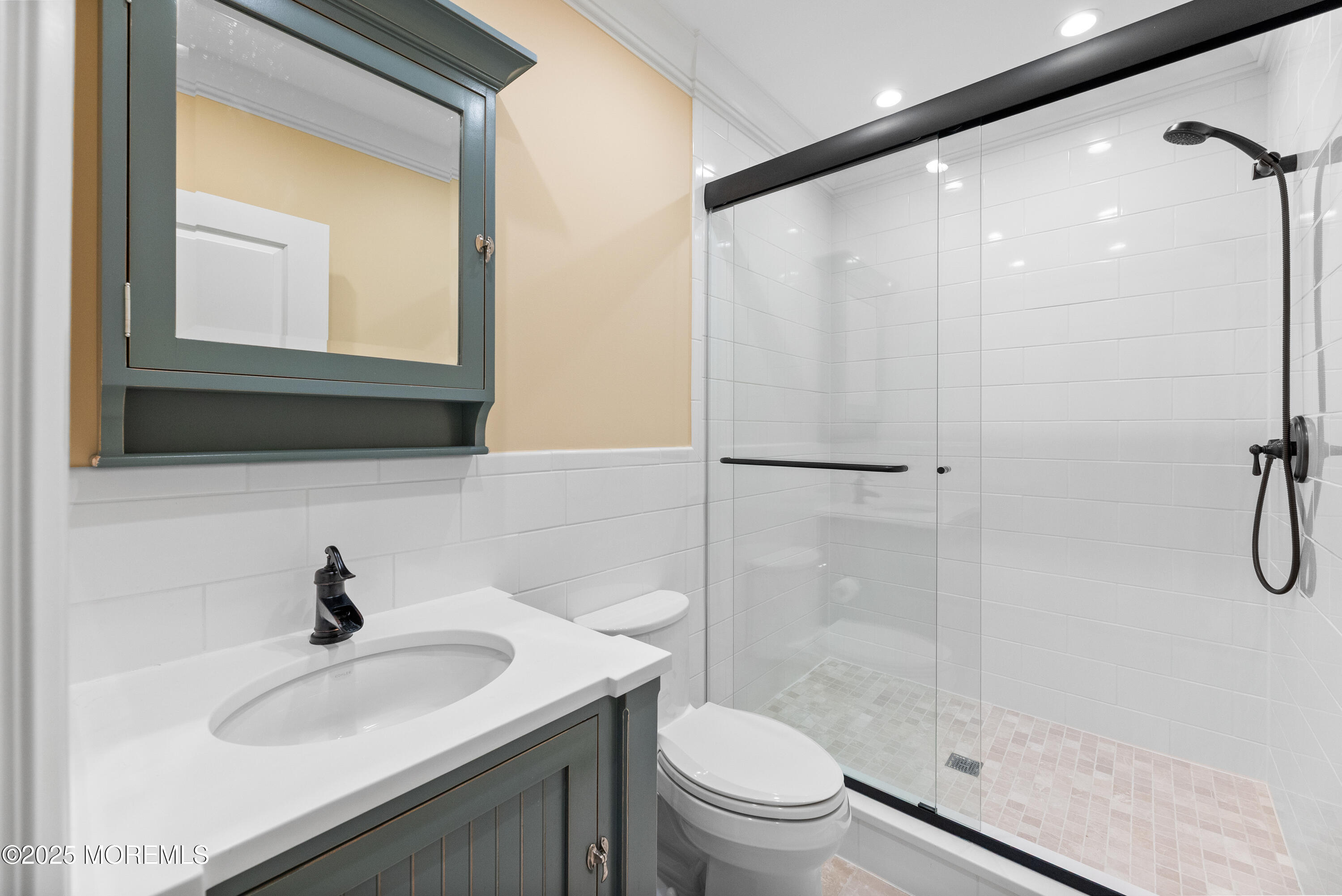 13 Indian Path Millstone Township, NJ 08535 - Photo 46 of 67 a bathroom with a sink a toilet and a mirror