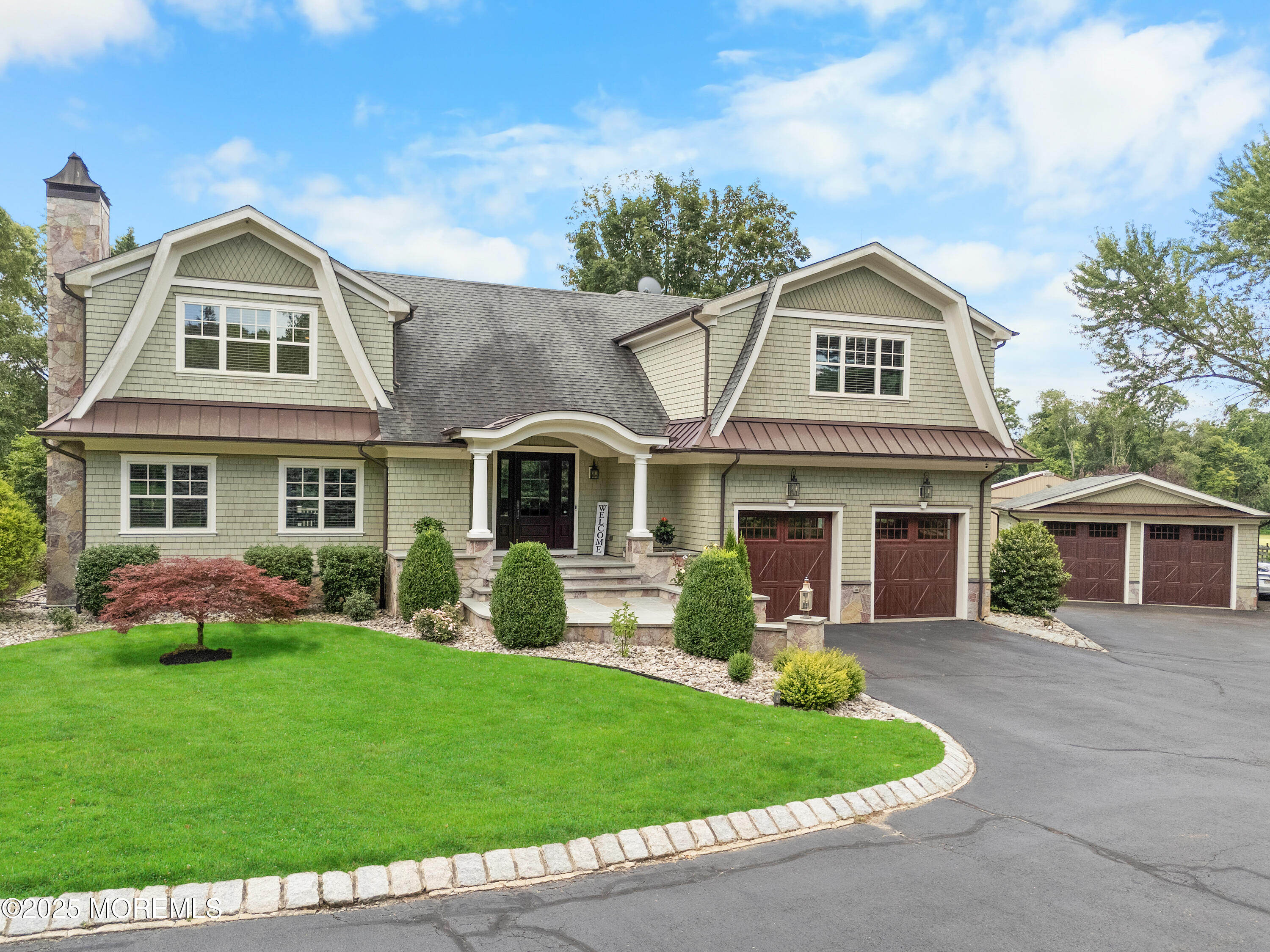 13 Indian Path Millstone Township, NJ 08535 - Photo 56 of 67 a front view of a house with a garden and porch