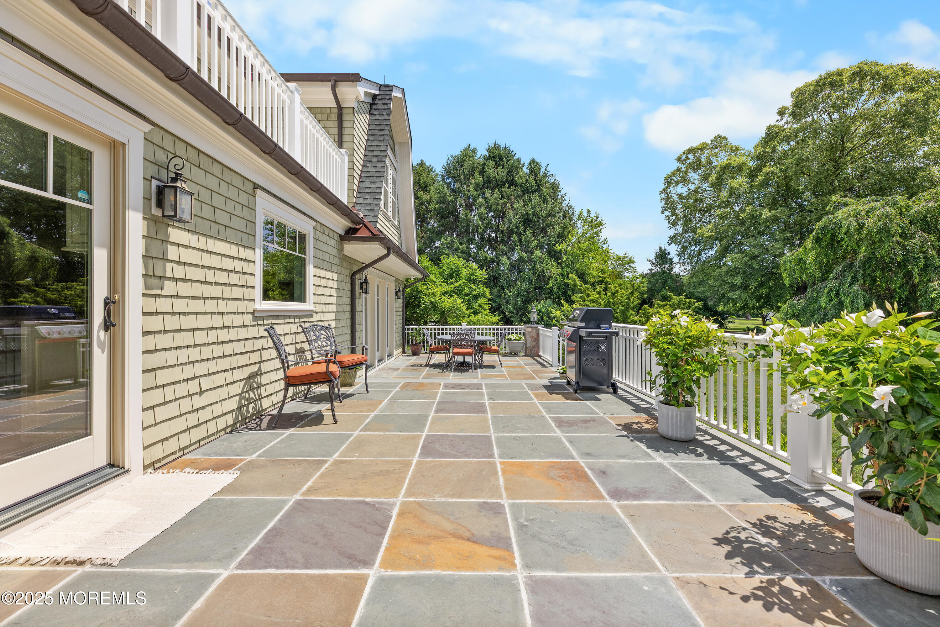 13 Indian Path Millstone Township, NJ 08535 - Photo 60 of 67 a view of a balcony with two chairs and a potted plant