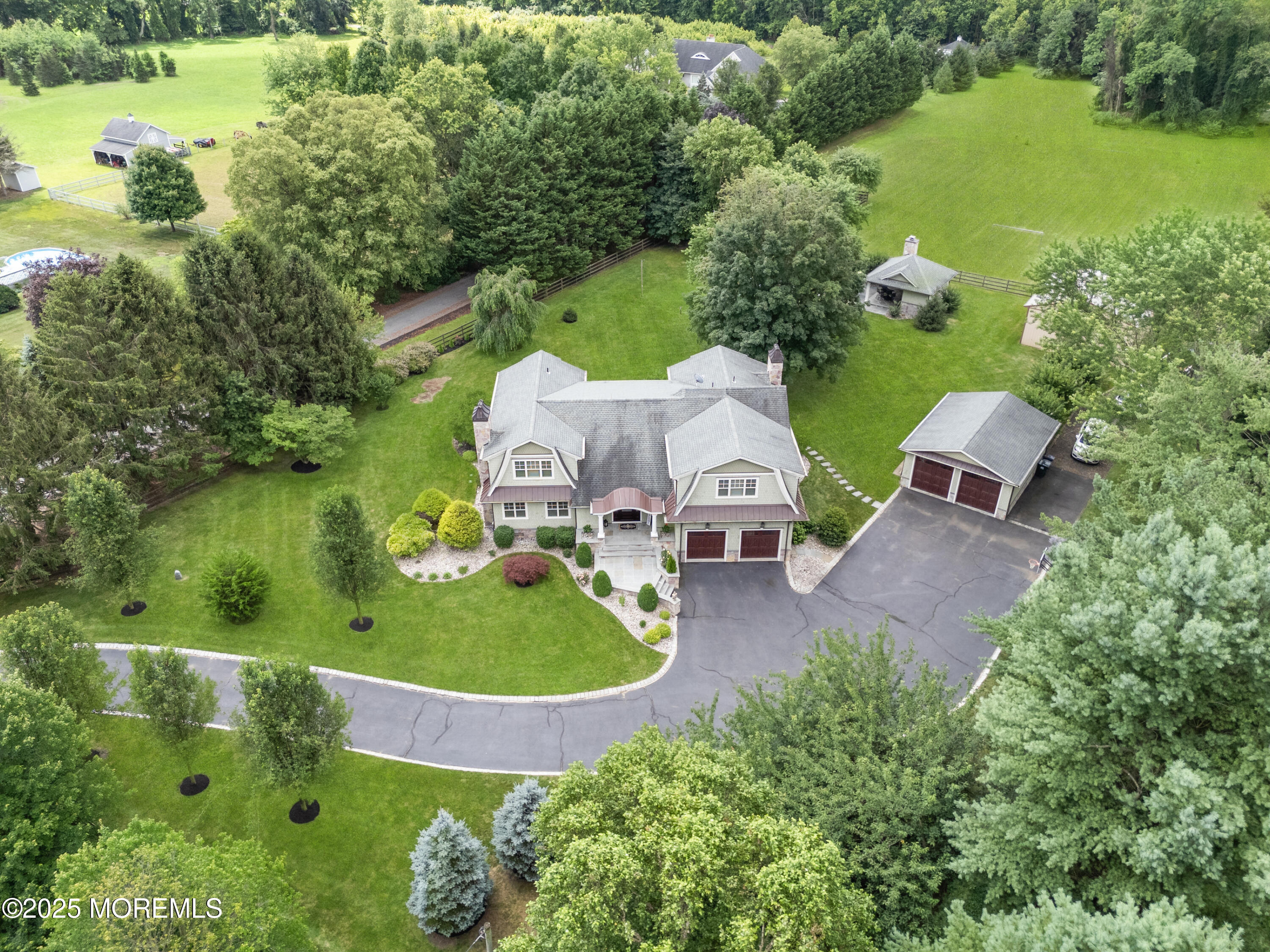 13 Indian Path Millstone Township, NJ 08535 - Photo 65 of 67 an aerial view of a house with a garden and lake view