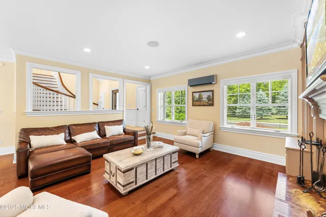 a living room with furniture fireplace and window