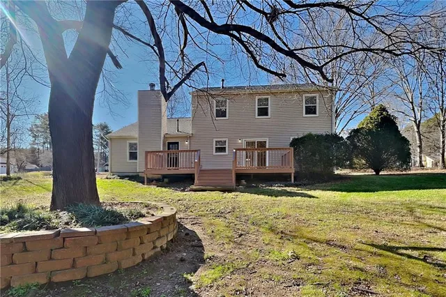 a view of a house with snow in the background