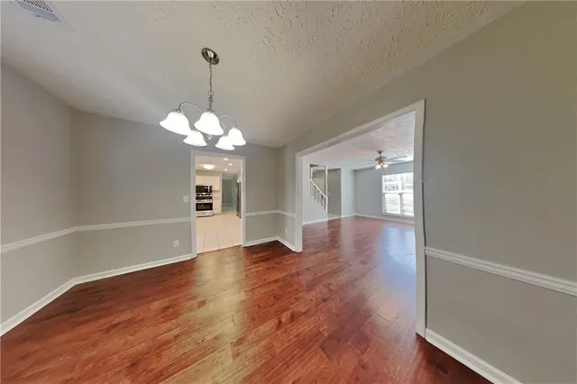 a view of livingroom with window and wooden floor