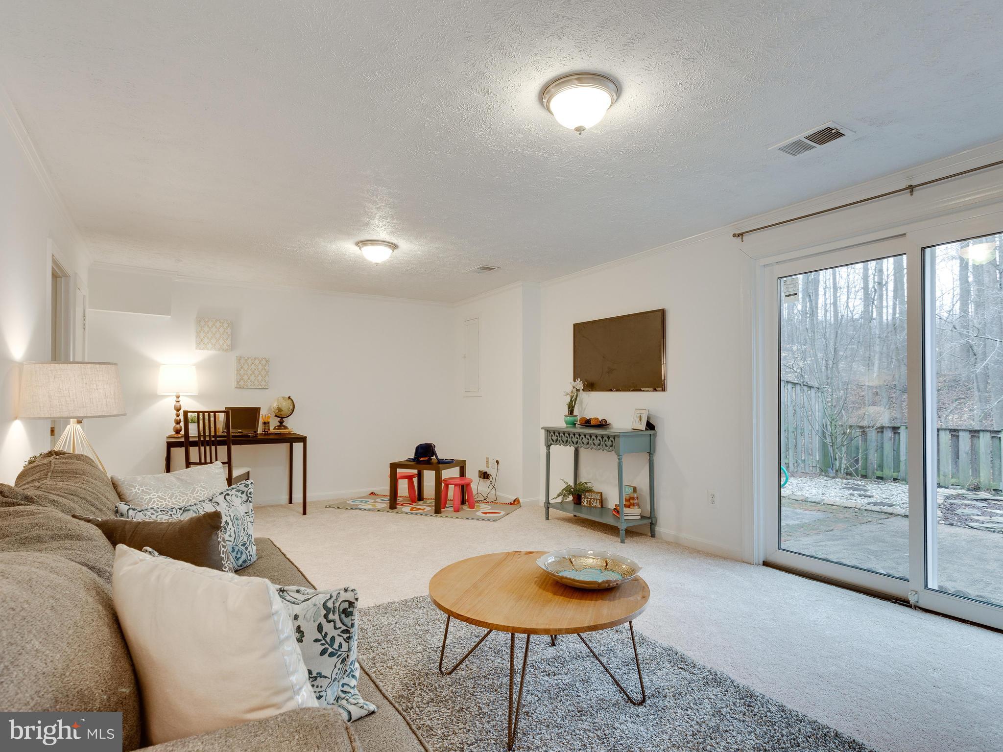 5523 Miles Court Springfield, VA 22151 - Photo 16 of 23 Family Room in the Basement w/ Sliding Glass Doors