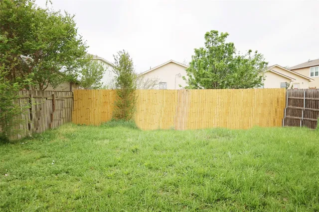 a view of backyard with green space