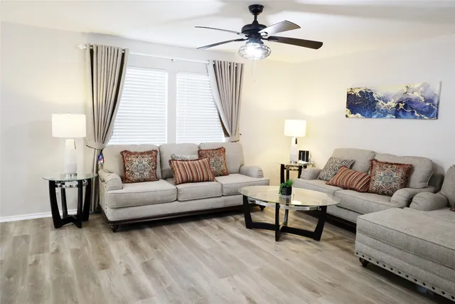 a living room with furniture and a window