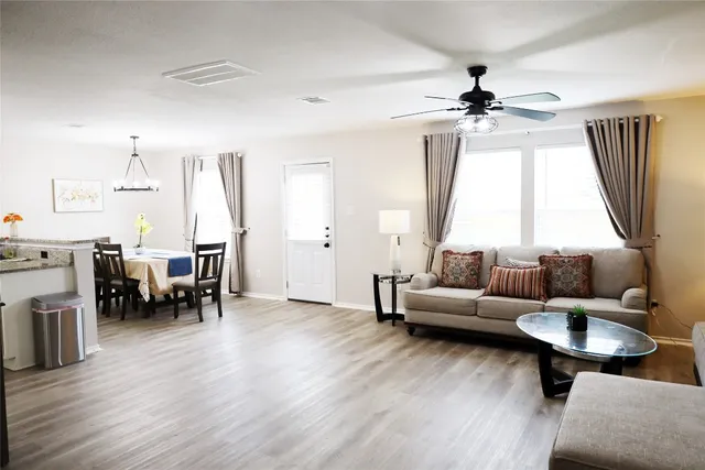 a living room with furniture and a large window
