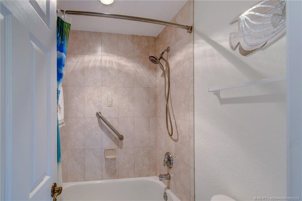 3541 Northeast Ocean Boulevard, Unit 19 Stuart, FL 34996 - Photo 31 of 52 a bathroom with a shower and a shower