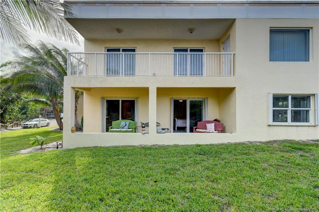 3541 Northeast Ocean Boulevard, Unit 19 Stuart, FL 34996 - Photo 33 of 52 a view of a house with sitting area and garden