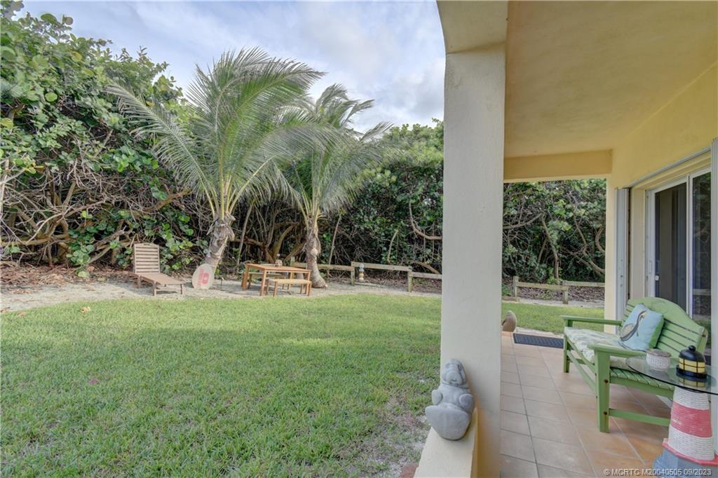 3541 Northeast Ocean Boulevard, Unit 19 Stuart, FL 34996 - Photo 37 of 52 a view of a backyard with garden