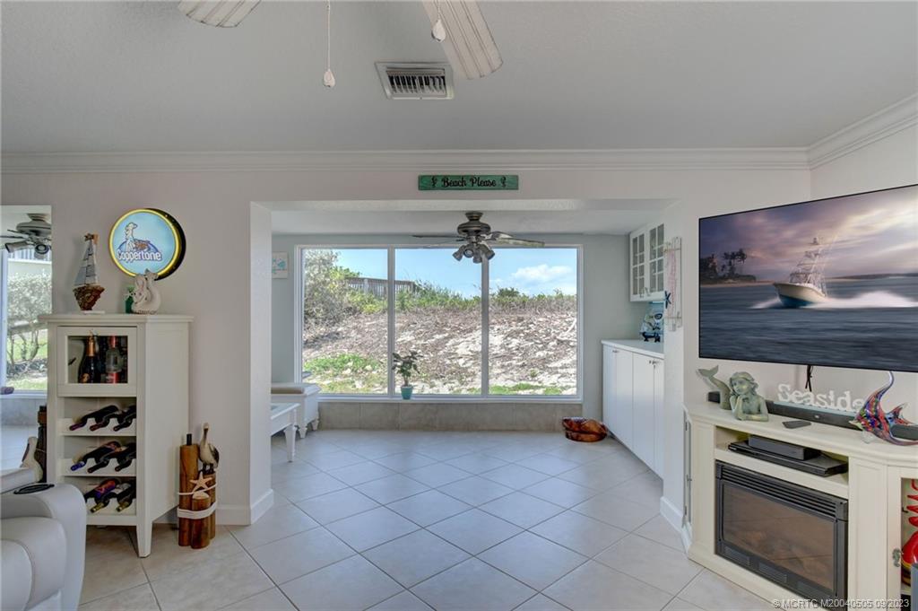 3541 Northeast Ocean Boulevard, Unit 19 Stuart, FL 34996 - Photo 4 of 52 a open kitchen with stainless steel appliances a stove and a large window
