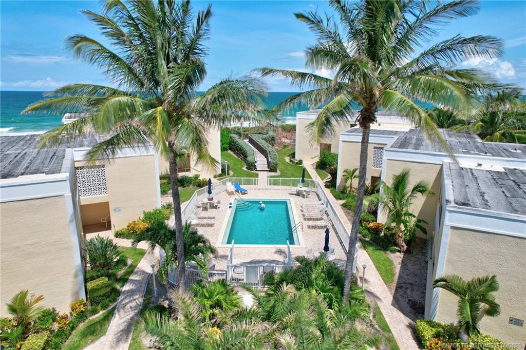 3541 Northeast Ocean Boulevard, Unit 19 Stuart, FL 34996 - Photo 40 of 52 a view of outdoor space yard and swimming pool