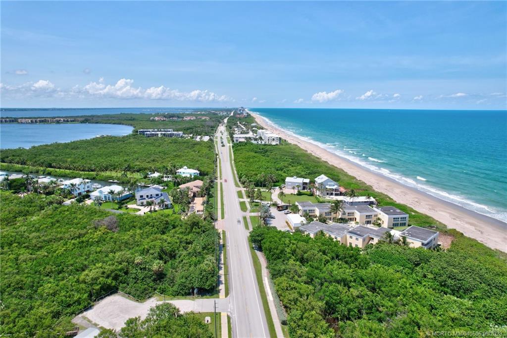3541 Northeast Ocean Boulevard, Unit 19 Stuart, FL 34996 - Photo 49 of 52 a view of a city street from a yard