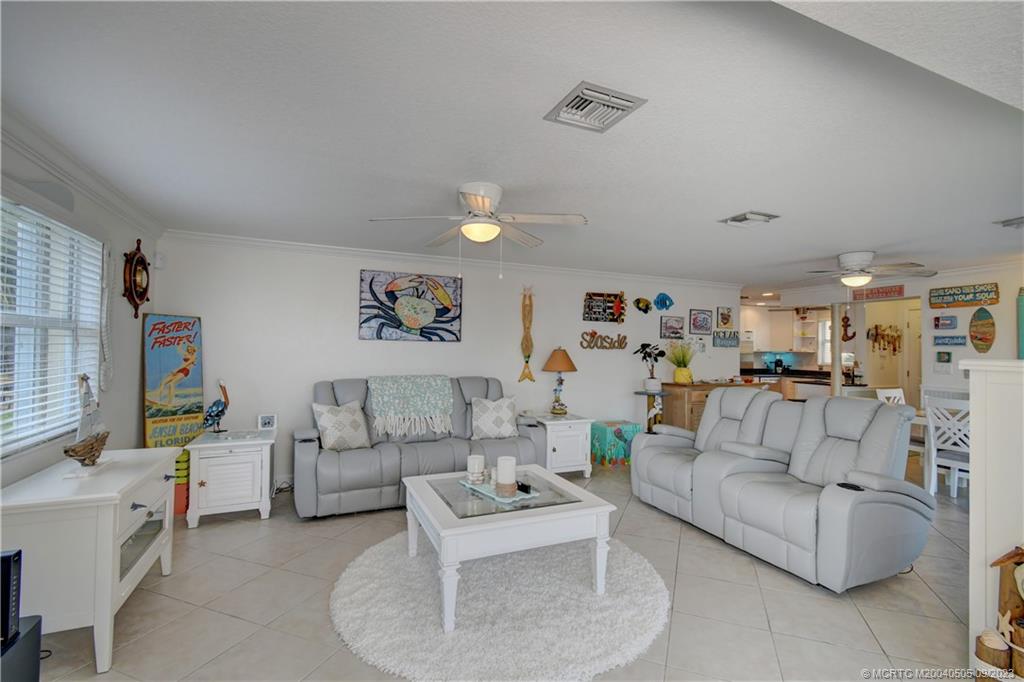3541 Northeast Ocean Boulevard, Unit 19 Stuart, FL 34996 - Photo 8 of 52 a living room with furniture and a couch