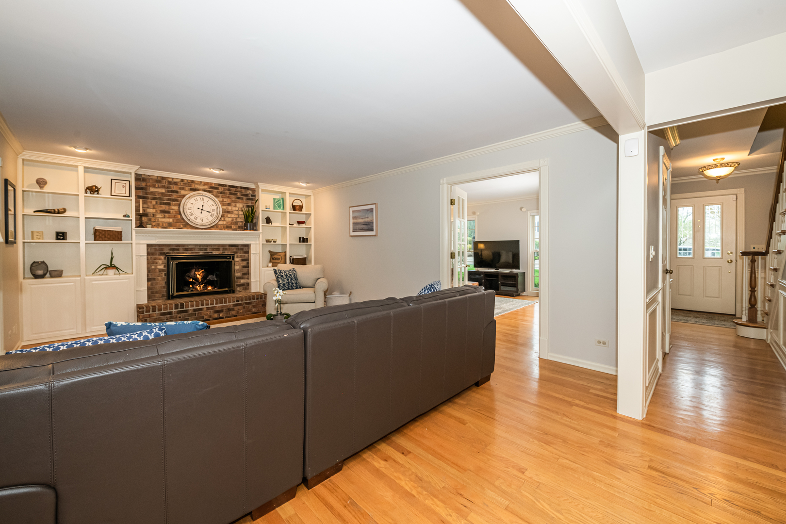 117 Whitney Drive Barrington, IL 60010 - Photo 13 of 37 a living room with furniture wooden floor and a fireplace