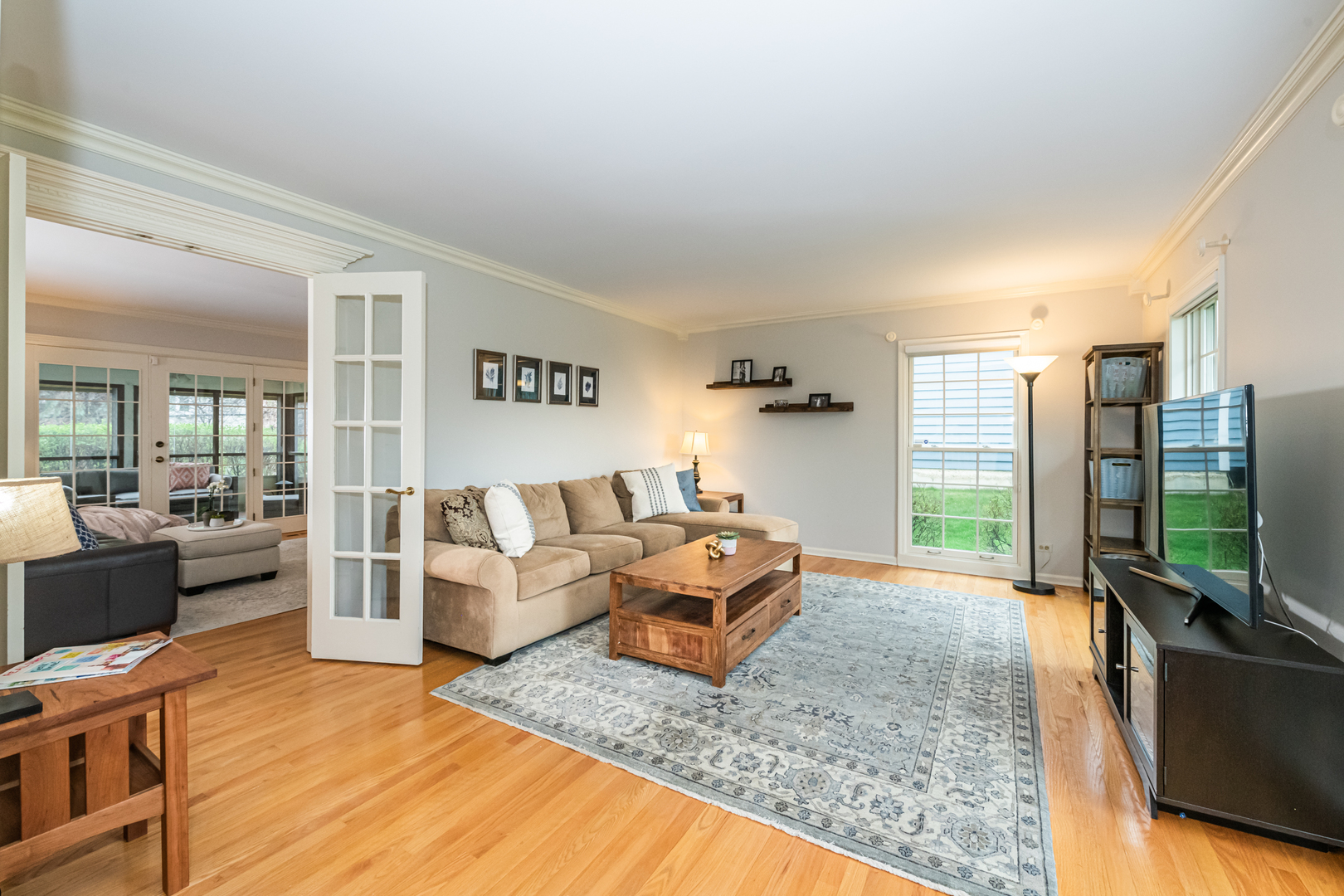 117 Whitney Drive Barrington, IL 60010 - Photo 14 of 37 a living room with furniture wooden floor and a flat screen tv