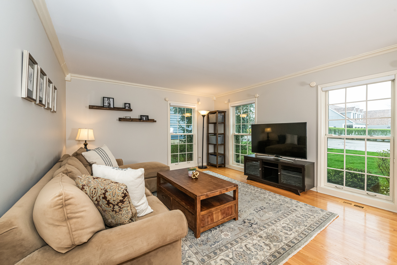 117 Whitney Drive Barrington, IL 60010 - Photo 15 of 37 a living room with furniture and a flat screen tv