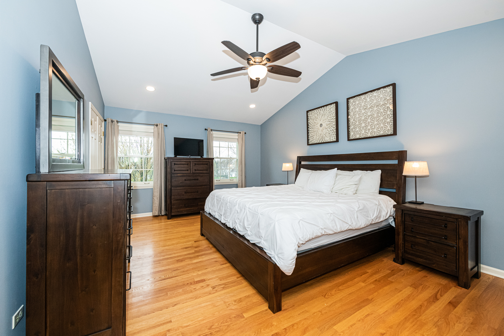 117 Whitney Drive Barrington, IL 60010 - Photo 22 of 37 a spacious bedroom with a bed and a ceiling fan