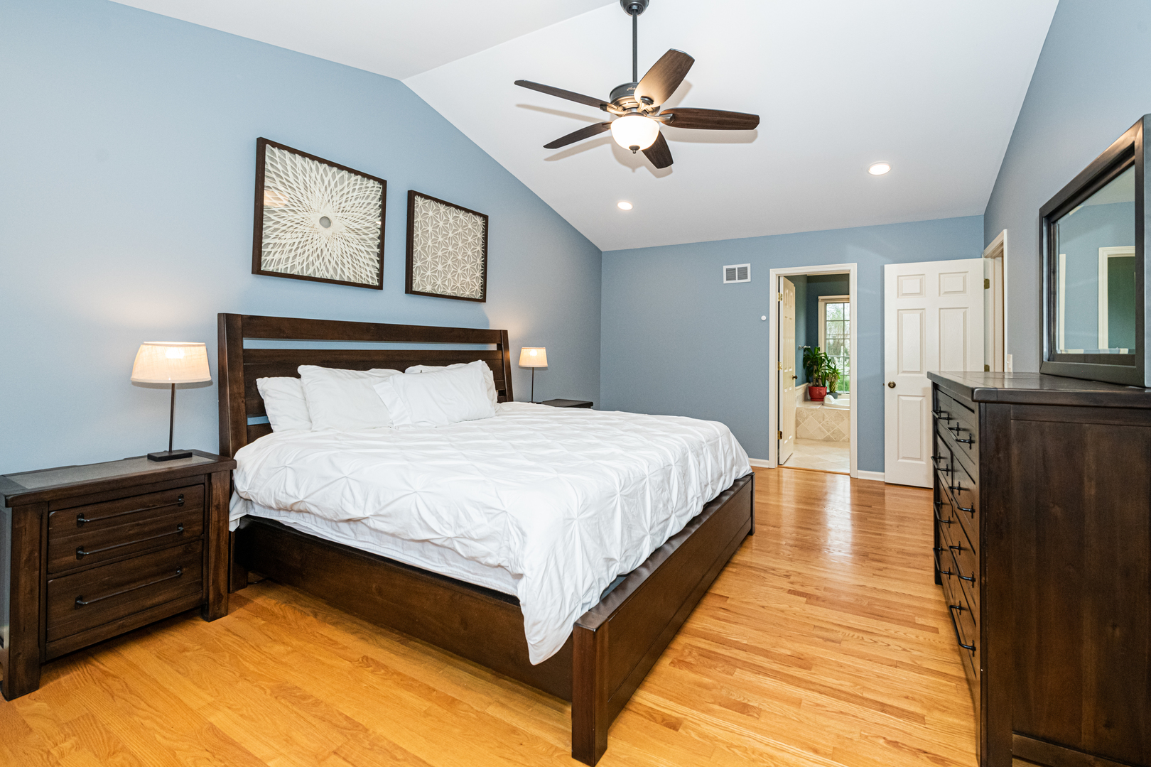 117 Whitney Drive Barrington, IL 60010 - Photo 23 of 37 a bedroom with a bed and a chandelier