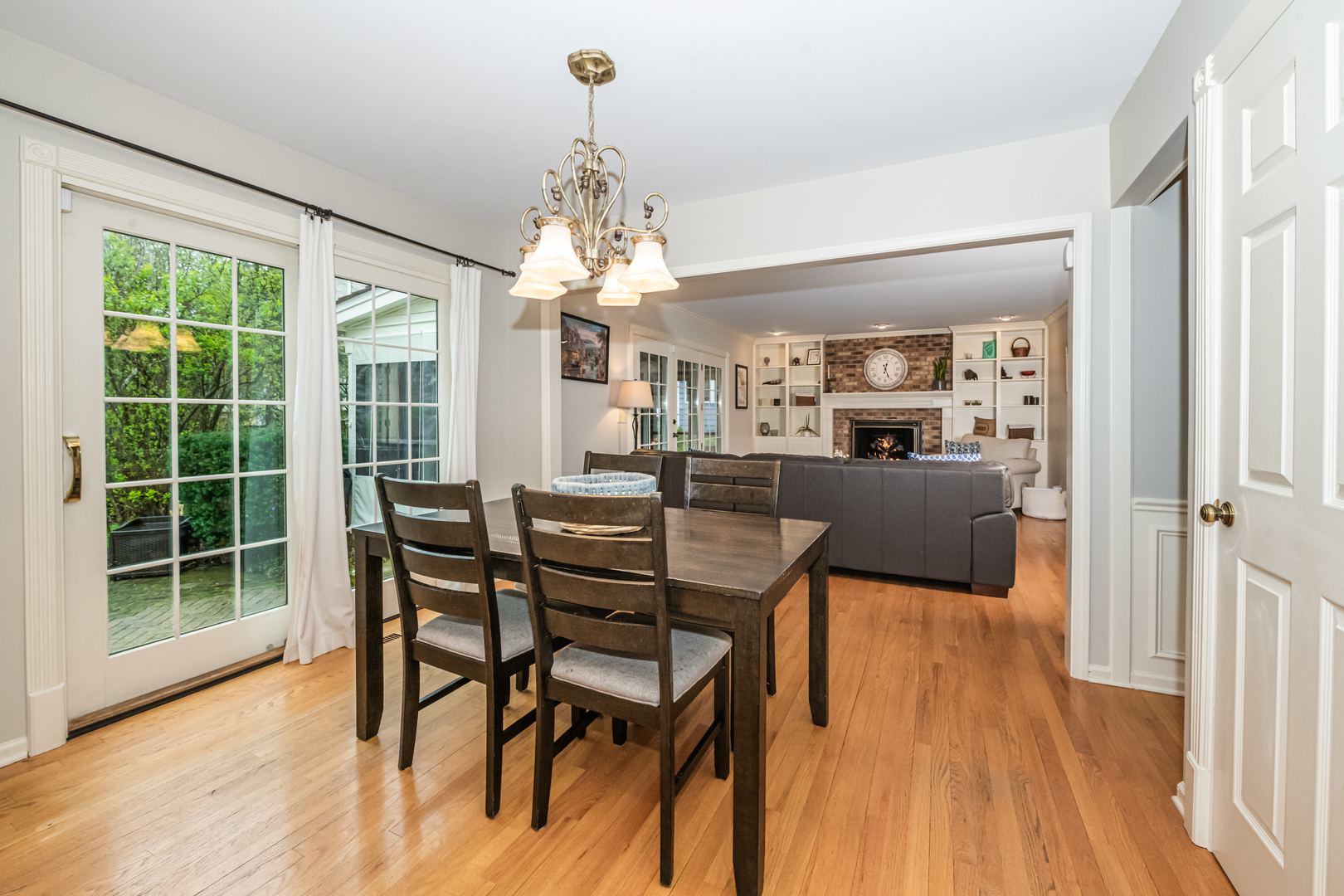 117 Whitney Drive Barrington, IL 60010 - Photo 9 of 37 a view of a dining room with furniture wooden floor and chandelier