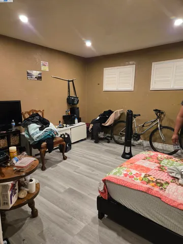 a bedroom with bed and a window