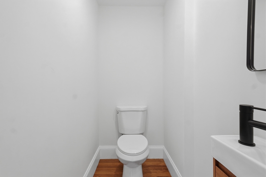 105 Stafford Road Lowell, MA 01852 - Photo 13 of 42 a white toilet sitting in a bathroom
