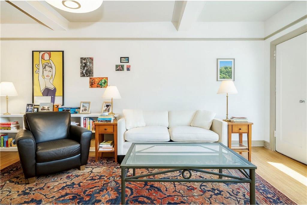 70 Remsen Street, Unit 4F Brooklyn, NY 11201 - Photo 2 of 11 a living room with furniture and a table