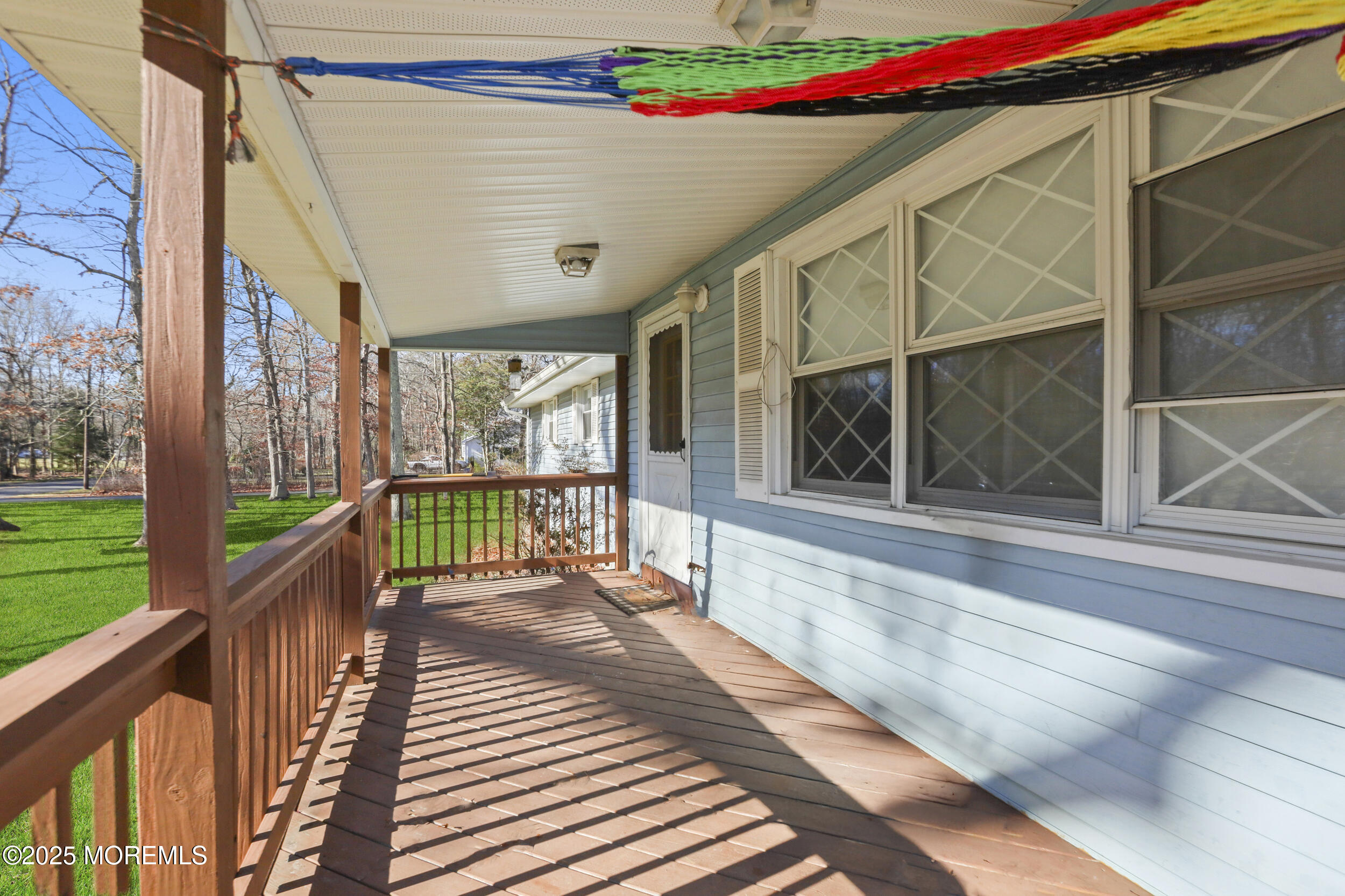 58 East Pleasant Grove Road Jackson, NJ 08527 - Photo 5 of 8 a balcony with wooden floor and glass door