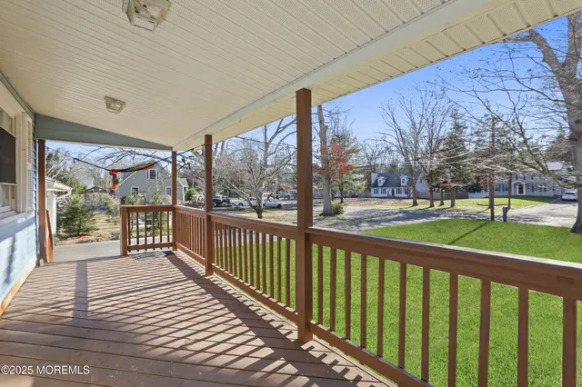 a view of a deck with a big yard