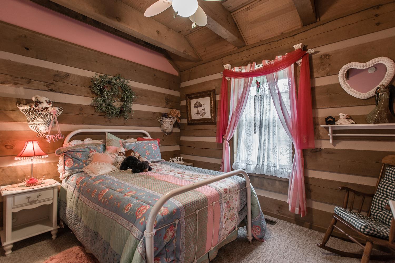 6161 Red River School Road Portland, TN 37148 - Photo 12 of 29 a bedroom with a bed and a fireplace