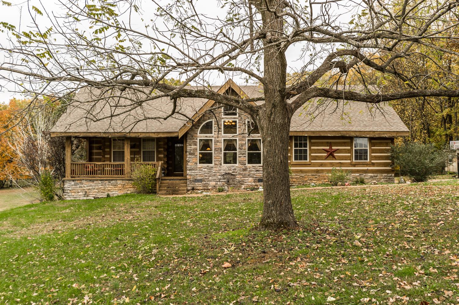 6161 Red River School Road Portland, TN 37148 - Photo 2 of 29 a front view of a house with garden