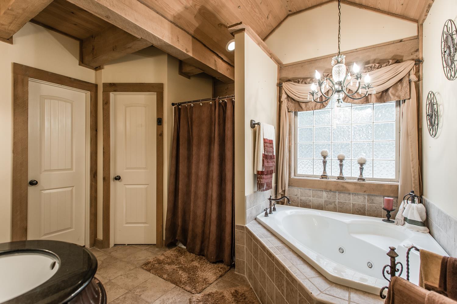 6161 Red River School Road Portland, TN 37148 - Photo 21 of 29 a bathroom with a tub a sink and a large mirror