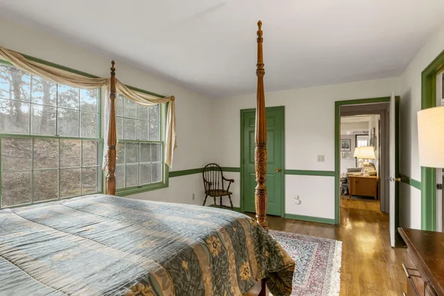 a bedroom with a bed and a book shelf