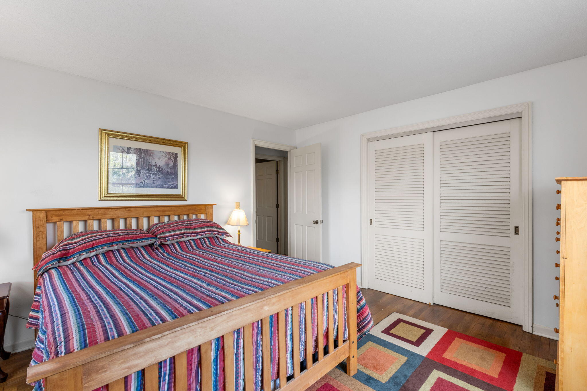 46 Chippingstone Road Chatham, MA 02633 - Photo 19 of 35 a bedroom with a bed and a book shelf