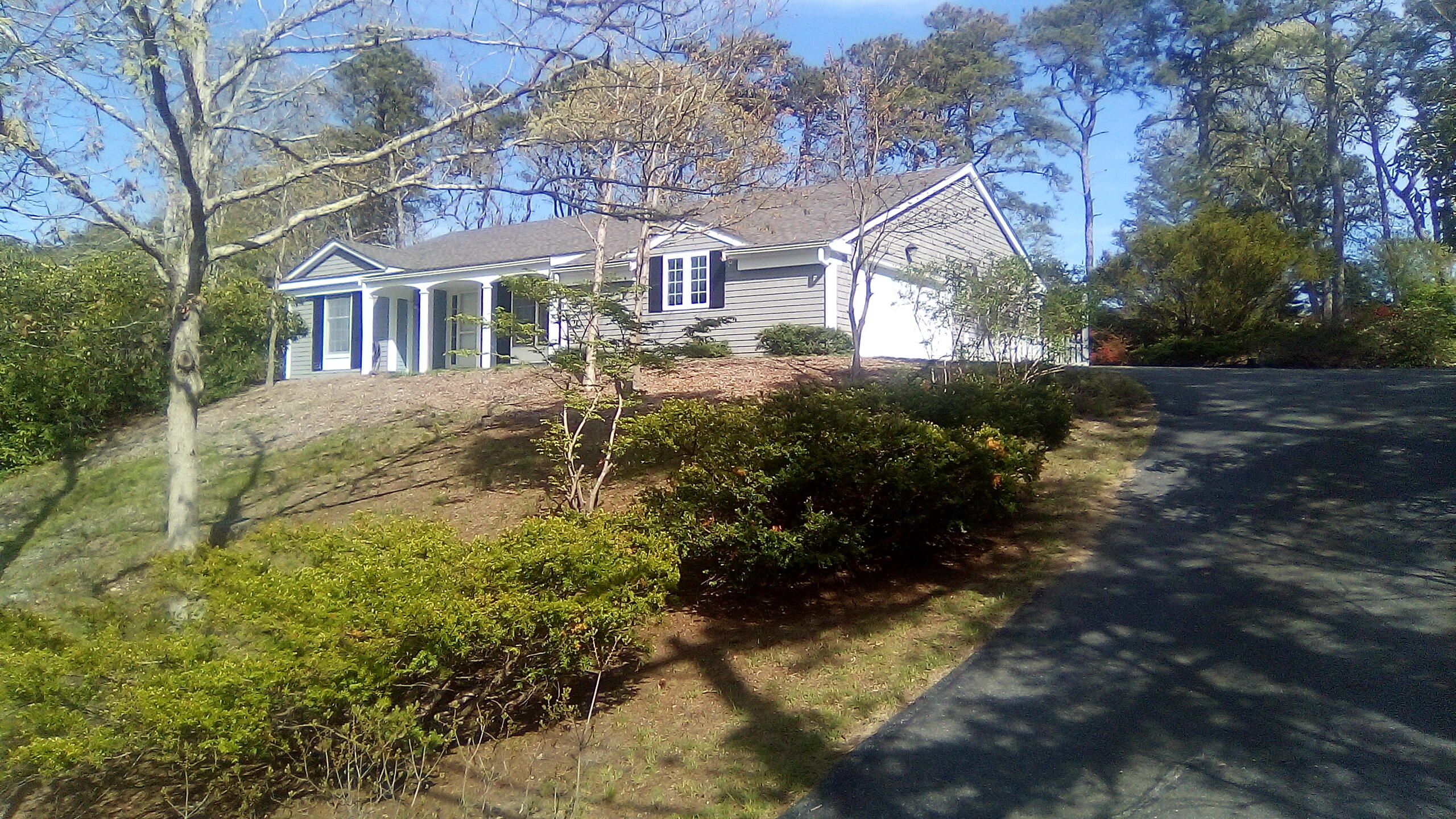 46 Chippingstone Road Chatham, MA 02633 - Photo 2 of 35 a front view of a house with a yard